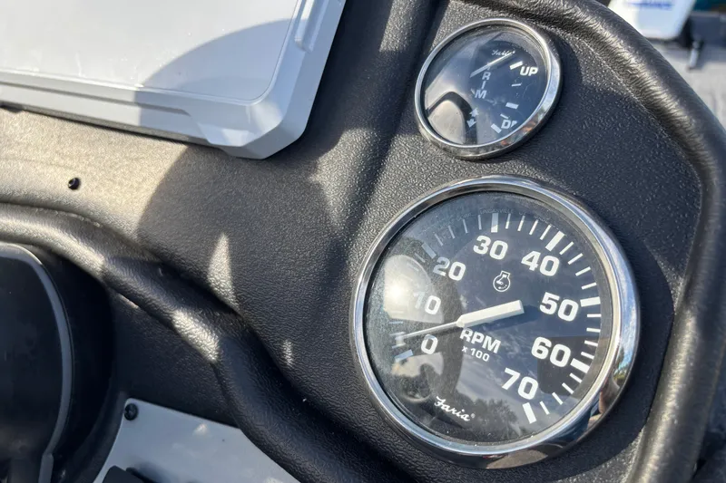 Slide: The Image of Close-up of 2027 Ranger RT188 boat dashboard with RPM and trim gauges. - 7