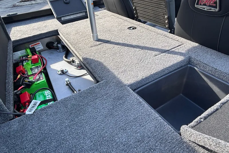 Slide: The Image of Interior view of 2027 Ranger RT188 boat showing battery compartment and storage area. - 11