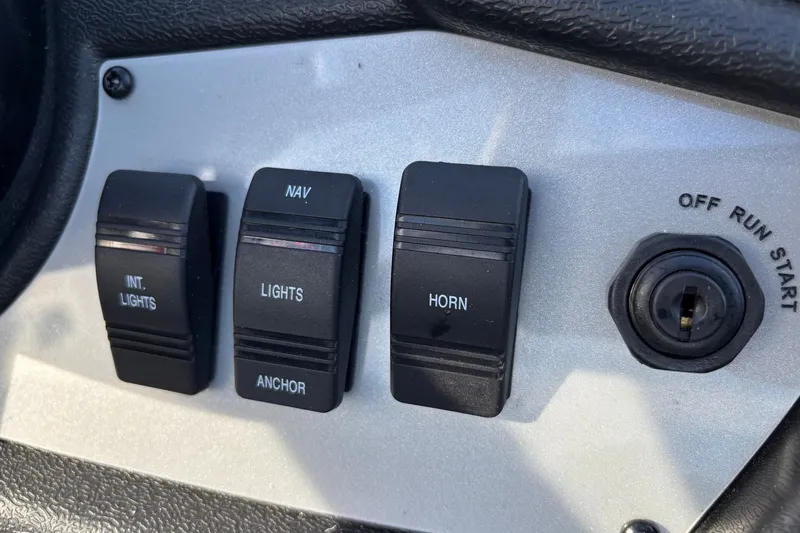 Slide: The Image of Control panel of 2027 Ranger RT188 with switches for lights, horn, and ignition. - 6