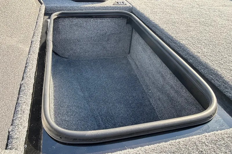 Slide: The Image of Storage compartment of 2027 Ranger RT188 boat, featuring carpeted interior and durable construction. - 14