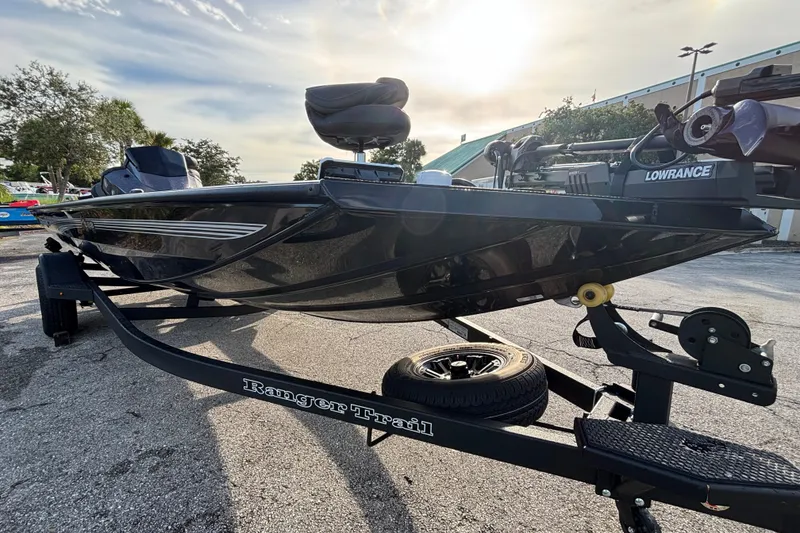 Slide: The Image of 2027 Ranger RT188 boat on trailer, featuring Lowrance equipment, parked outdoors. - 3