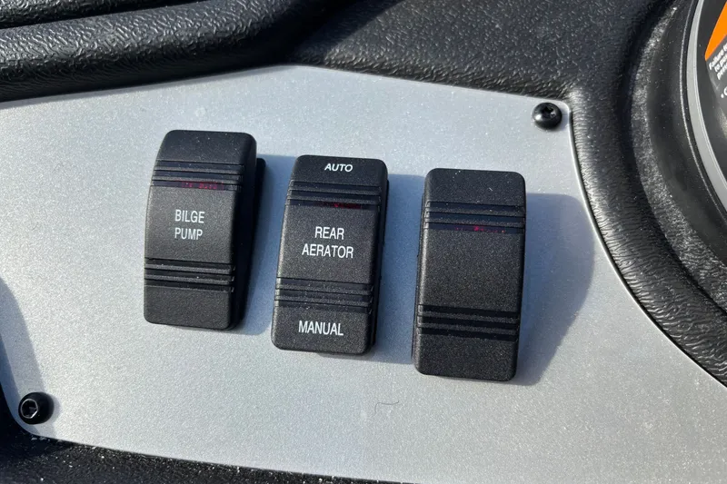Slide: The Image of Control panel of 2027 Ranger RT188 boat with bilge pump and aerator switches. - 9