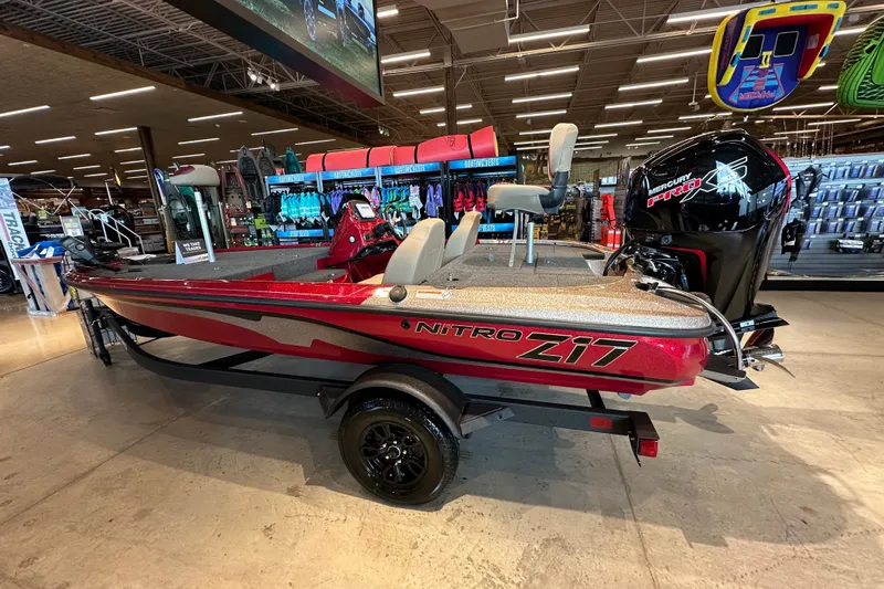 The Image of 2027 Nitro Z17 boat displayed indoors, featuring sleek red design and powerful Mercury engine. - 0