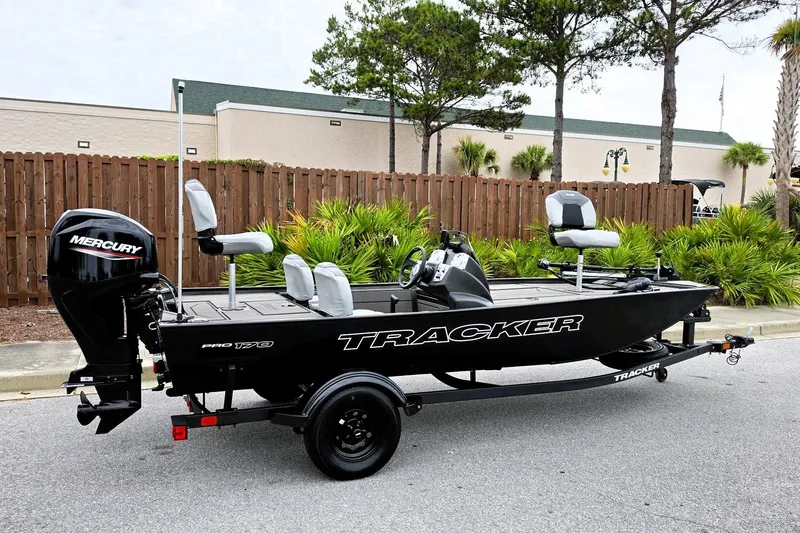 The Image of 2027 Tracker Pro 170 boat with Mercury engine on trailer, parked outdoors. - 0