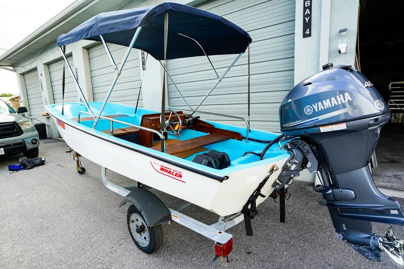 Slide: The Image of 1973 Boston Whaler 13 Sport boat with Yamaha outboard motor on trailer. - 3