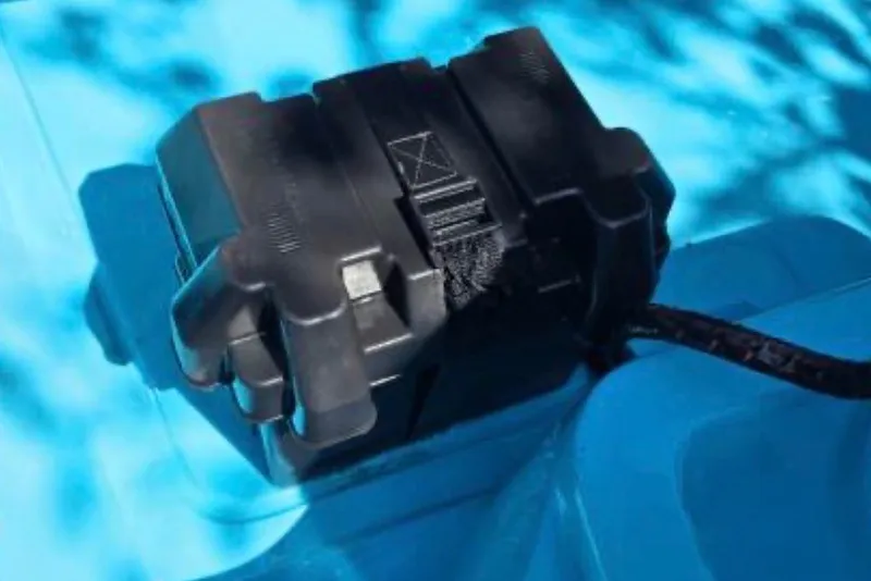 Slide: The Image of Battery box on a 1973 Boston Whaler 13 Sport boat, set against a blue background. - 6