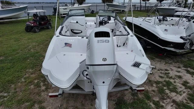 Slide: The Image of The image shows a white Stingray 22DC boat from 2027 with a 150 HP outboard motor. - 7
