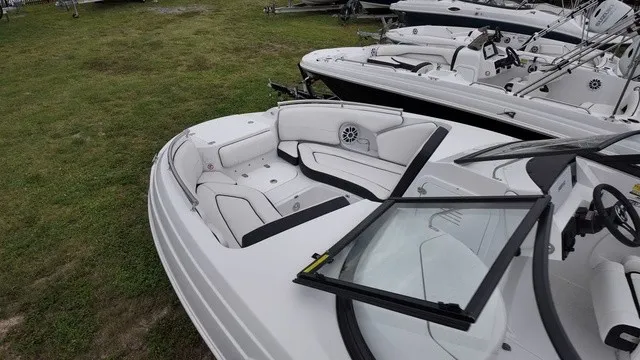 Slide: The Image of The image shows a modern Stingray 22DC boat from 2027 with white upholstery. - 4