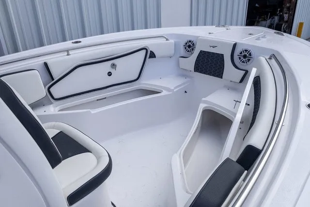 Slide: The Image of The image shows the bow of a Tidewater 232 CC Adventure boat with white and black upholstery and speakers. - 7
