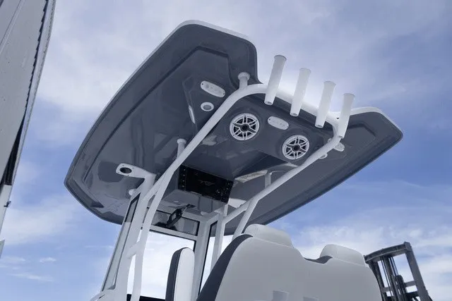 Slide: The Image of Tidewater 232 CC Adventure 2027 with T-top and speakers, set against a blue sky. - 19