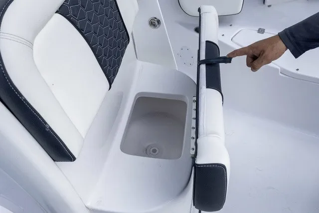 Slide: The Image of A white and black seat with a small storage compartment underneath. - 9