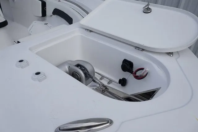 Slide: The Image of An open storage compartment on a boat with anchor and rope. - 1