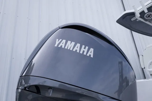 Slide: The Image of Close-up of a Yamaha outboard motor on a boat. - 23