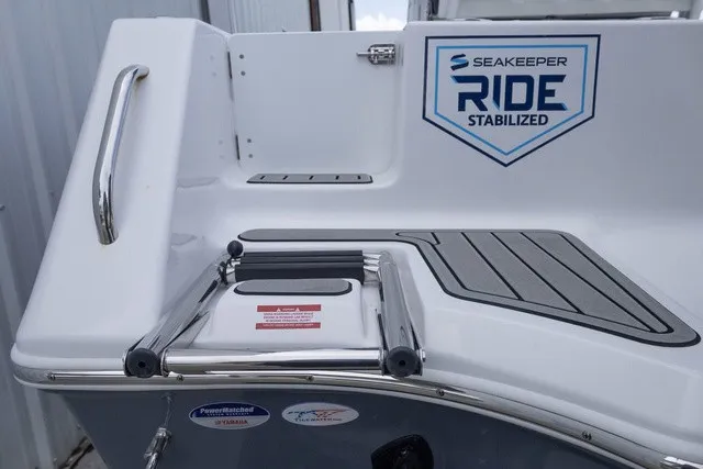 Slide: The Image of The image shows the stern of a Tidewater 232 CC Adventure boat with Seakeeper Ride stabilization. - 20