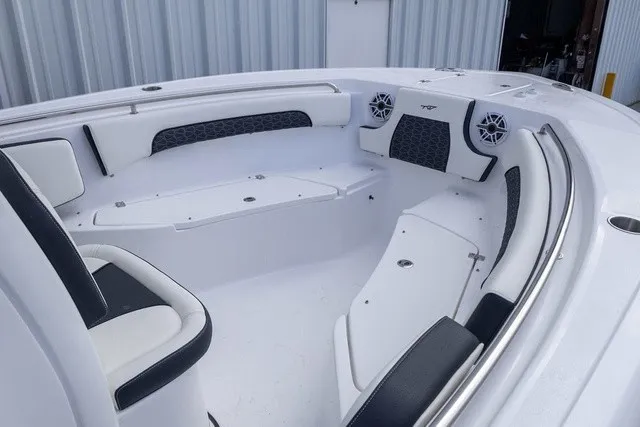 Slide: The Image of The image shows the bow area of a Tidewater 232 CC Adventure boat with cushioned seating. - 8