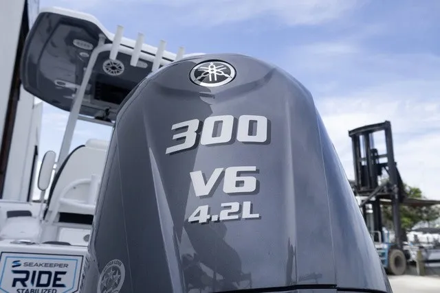 Slide: The Image of A Yamaha 300 V6 4.2L outboard motor is mounted on a Tidewater 232 CC Adventure boat. - 22