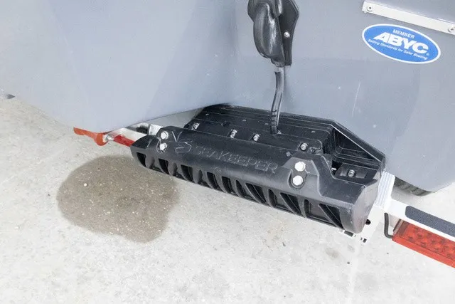 Slide: The Image of Close-up of a boat part with a black device and a blue sticker. - 24
