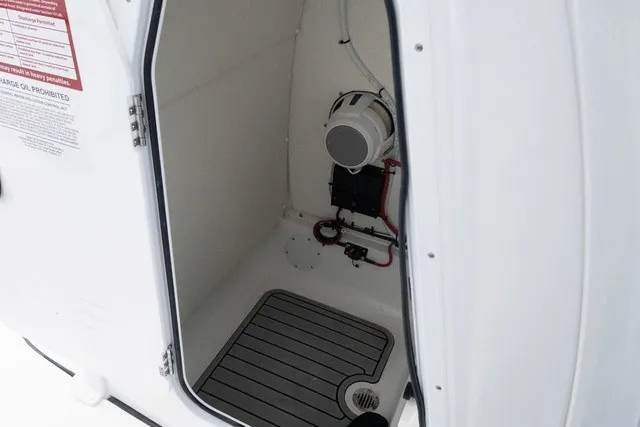 Slide: The Image of Interior of a boat with gray flooring and technical equipment mounted on the wall. - 10