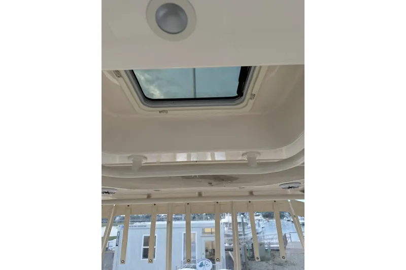Slide: The Image of 2020 Grady-White Freedom 325 boat interior with skylight view. - 18