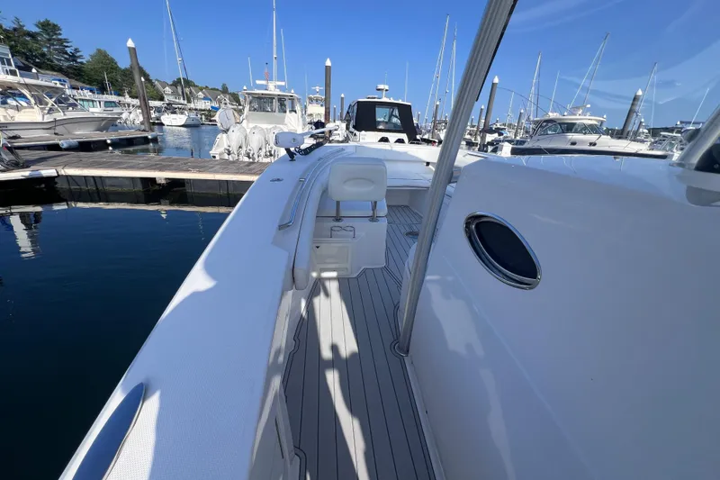 Slide: The Image of 2020 Southport 33 FE boat docked at marina with clear blue sky. - 33
