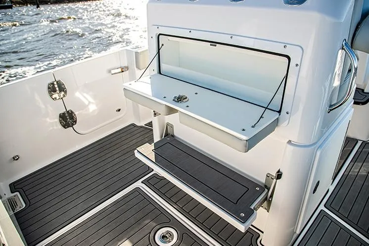 Slide: The Image of Manufacturer Provided Image: 2023 Everglades 235 Center Console boat interior with storage compartment and non-slip deck. - 18