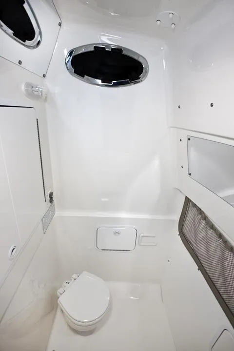 Slide: The Image of Interior of 2016 Regulator 28 Forward Seating with toilet. - 18