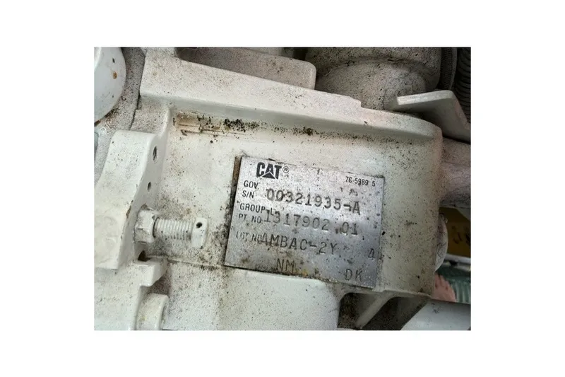 Slide: The Image of Close-up of a CAT engine part label on a 1997 Sea Ray Sundancer 400. - 38