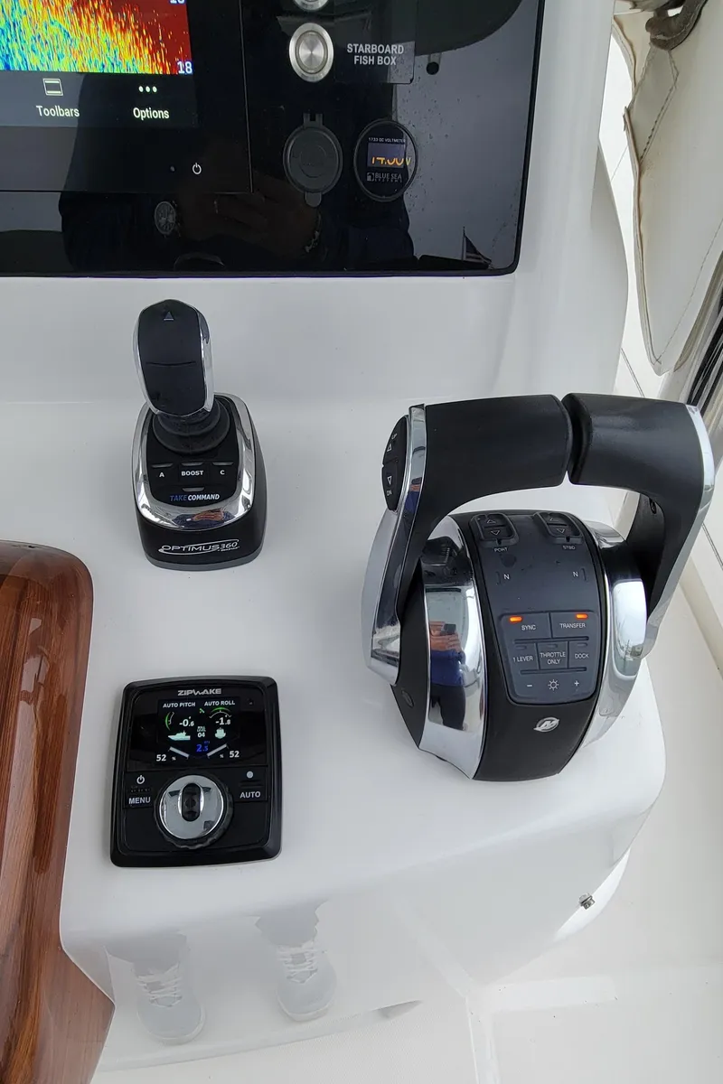 Slide: The Image of 2023 Mag Bay 33 CC boat controls and navigation display. - 24