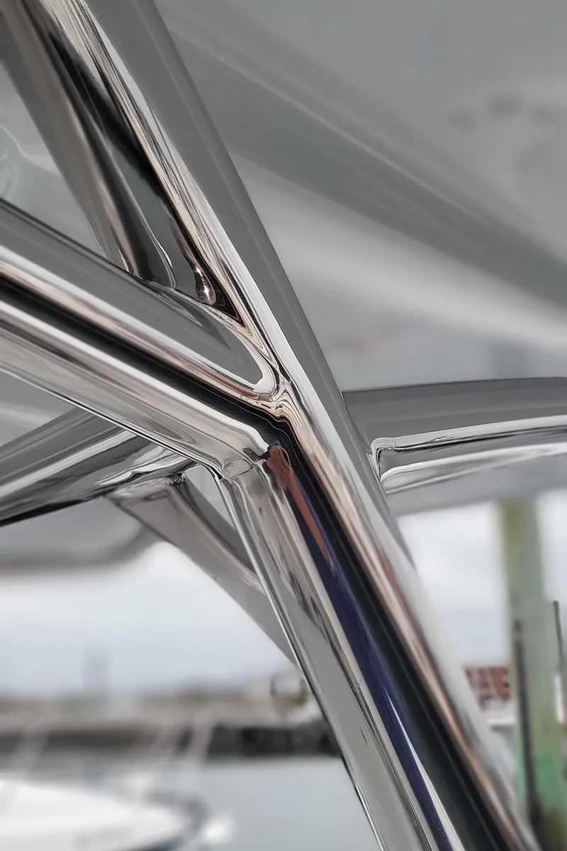 Slide: The Image of Close-up of 2023 Mag Bay 33 CC boat's sleek metal framework. - 33