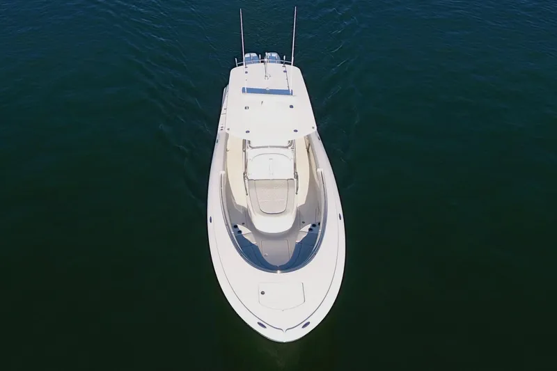 Slide: The Image of 2023 Mag Bay 33 CC boat on calm water, aerial view. - 14