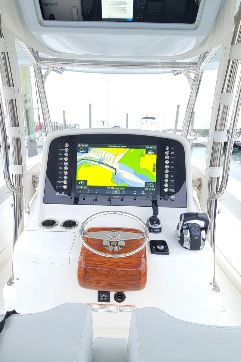 Slide: The Image of 2023 Mag Bay 33 CC boat dashboard with advanced navigation system. - 20