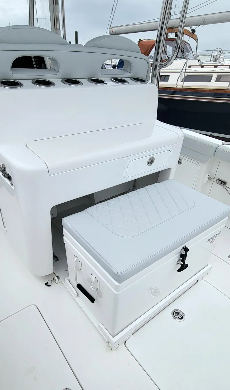 Slide: The Image of 2023 Mag Bay 33 CC boat interior with seating and storage. - 28