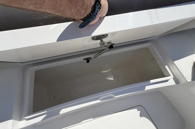 Slide: The Image of Open storage compartment on a 2015 Regulator 25 boat. - 36