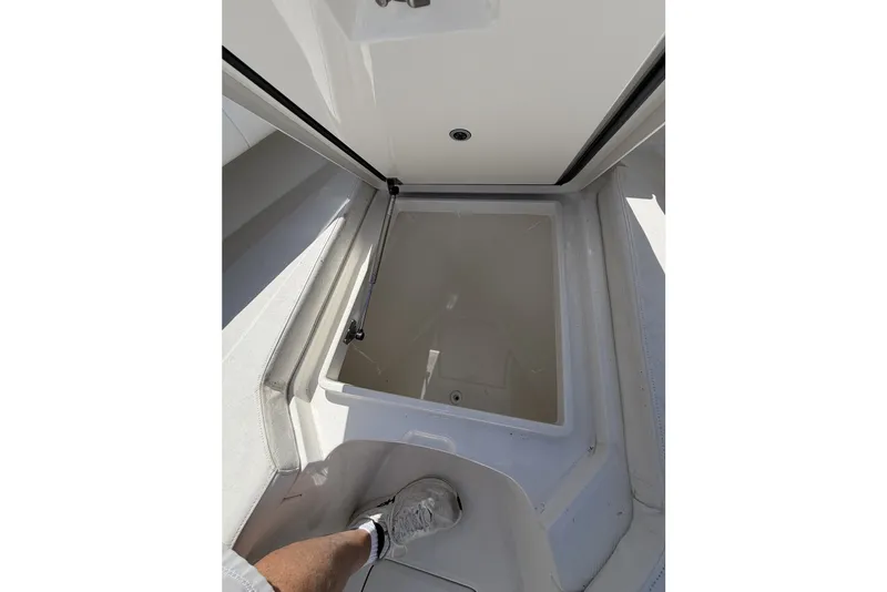 Slide: The Image of Open storage compartment on a 2015 Regulator 25 boat, showcasing interior space. - 20