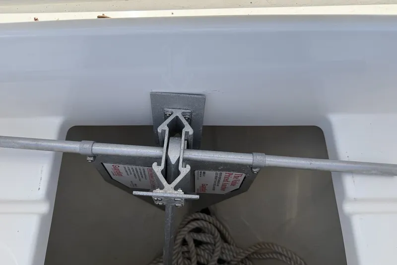 Slide: The Image of Anchor locker of a 2015 Regulator 25 boat with rope and metal fittings. - 23