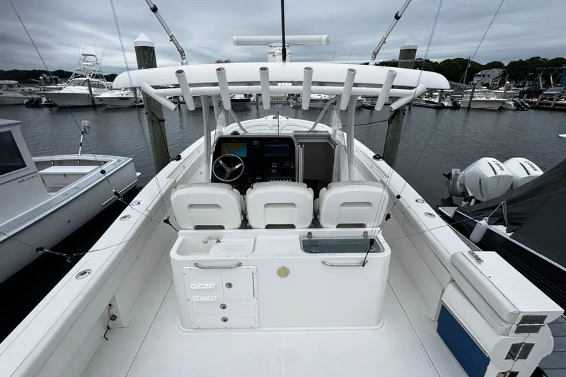 Slide: The Image of 2017 Stamas 390 Tarpon boat docked, featuring a spacious cockpit and modern controls. - 12
