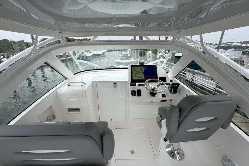 Slide: The Image of Interior view of 2024 Albemarle 30 Express boat cockpit with modern controls and seating. - 43