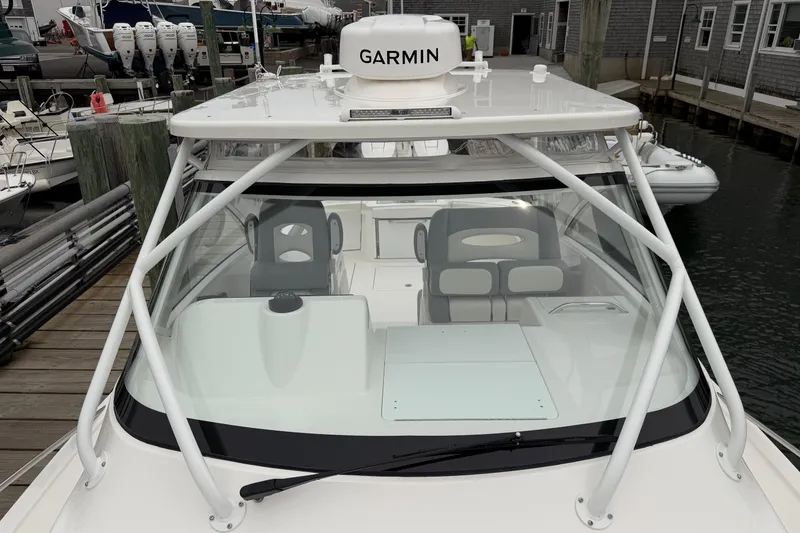 Slide: The Image of 2024 Albemarle 30 Express boat with Garmin equipment, docked at a marina. - 58