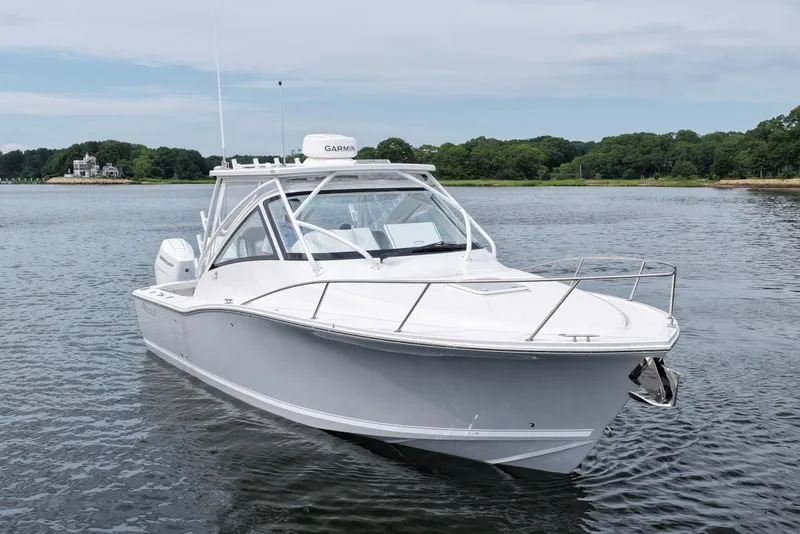 Slide: The Image of 2024 Albemarle 30 Express boat on calm water, showcasing sleek design and modern features. - 4