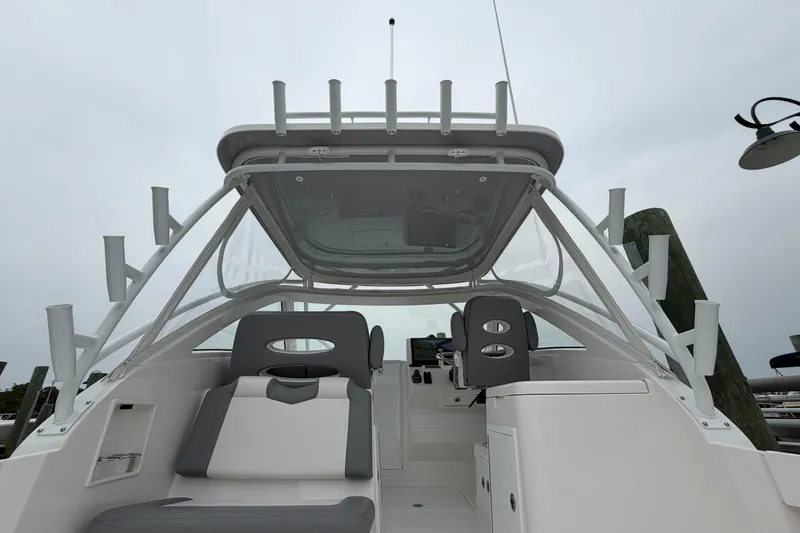 Slide: The Image of 2024 Albemarle 30 Express boat interior with seating and rod holders. - 25