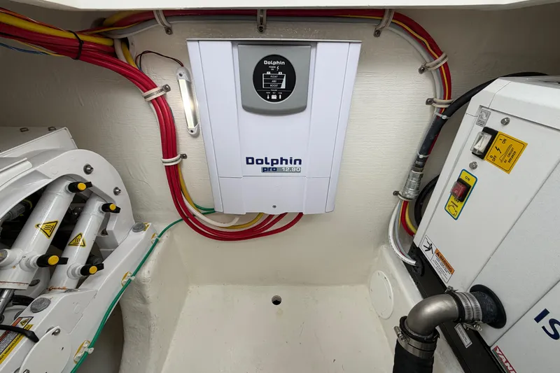 Slide: The Image of Electrical system inside 2024 Albemarle 30 Express boat, featuring Dolphin Pro charger. - 39