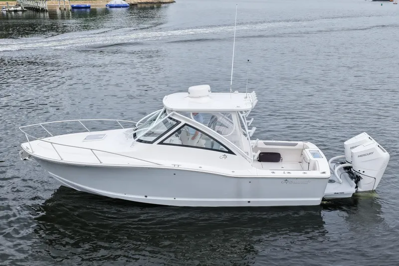 Slide: The Image of 2024 Albemarle 30 Express boat on calm water, side view. - 10
