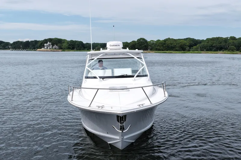 Slide: The Image of 2024 Albemarle 30 Express boat on calm water, front view. - 3