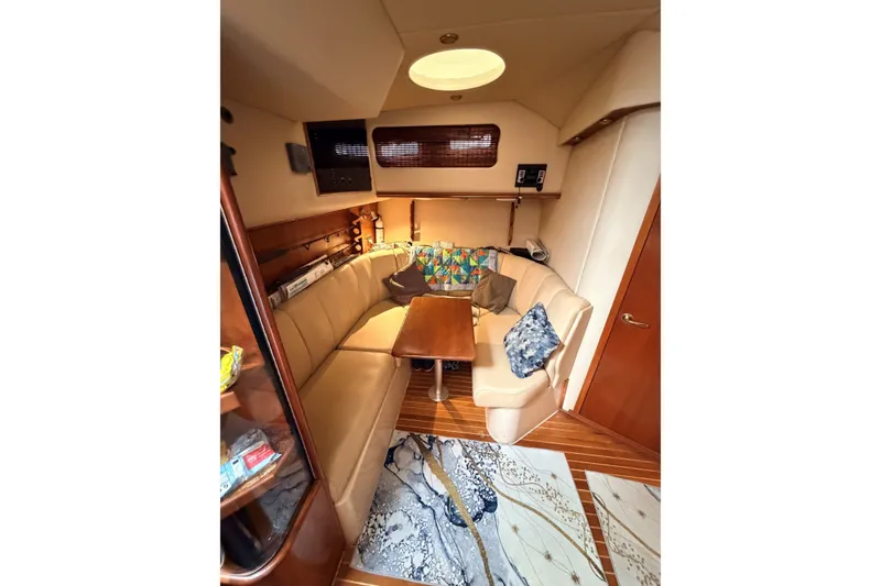Slide: The Image of Luxurious interior of 2003 Rampage 38 Express yacht with cozy seating and wooden accents. - 6
