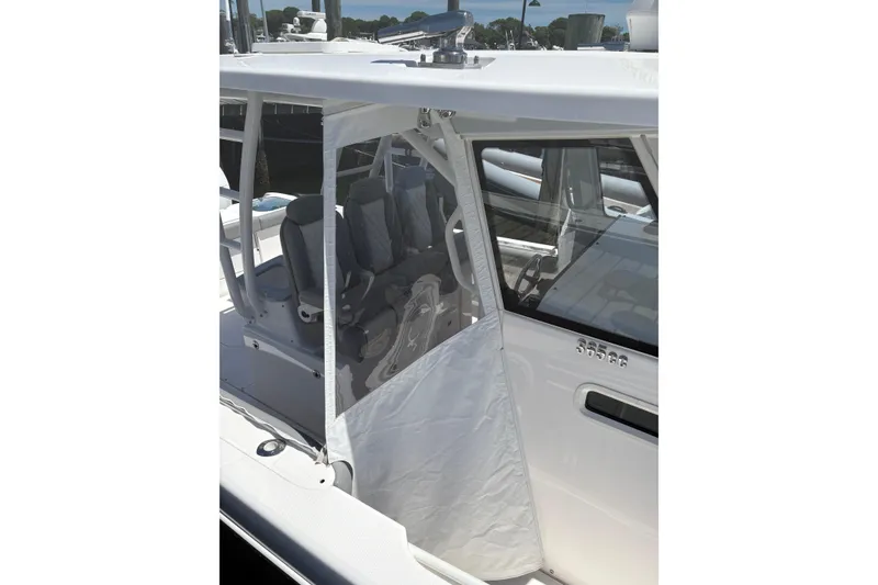 Slide: The Image of 2022 Everglades 365 Center Console boat with protective cover and seating area. - 35