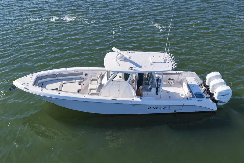 Slide: The Image of 2022 Everglades 365 Center Console boat cruising on open water. - 16