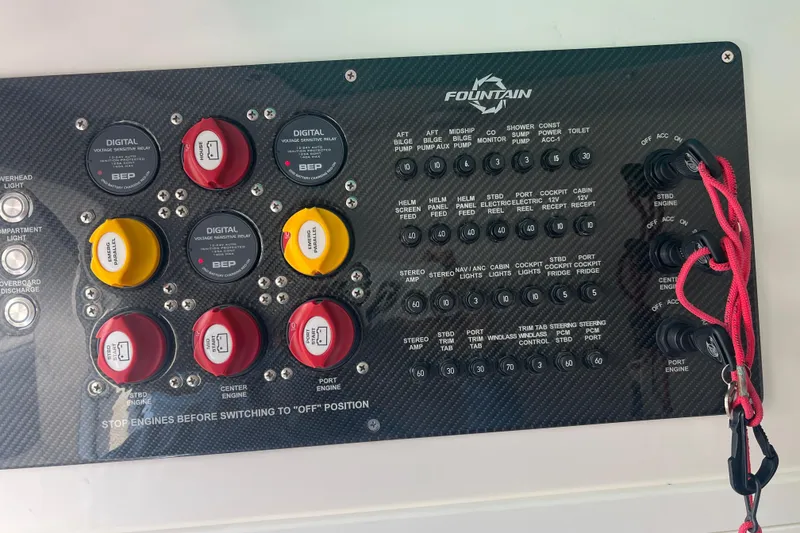 Slide: The Image of Control panel of a 2021 Fountain 39 NX boat with switches and relays. - 16