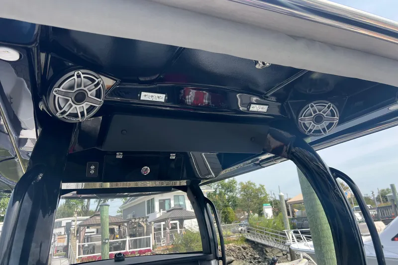 Slide: The Image of 2021 Fountain 39 NX boat interior with speakers and control panel. - 13