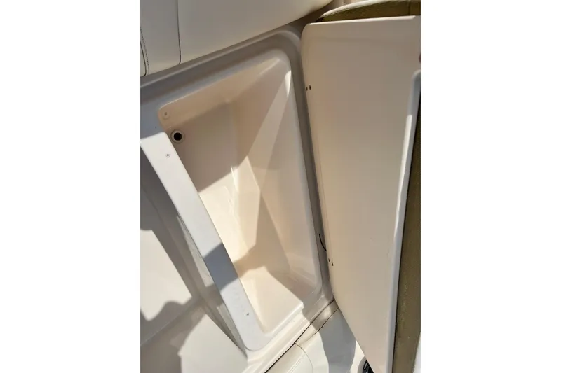 Slide: The Image of Storage compartment on a 2021 Grady-White Freedom 215 boat, open and empty. - 34