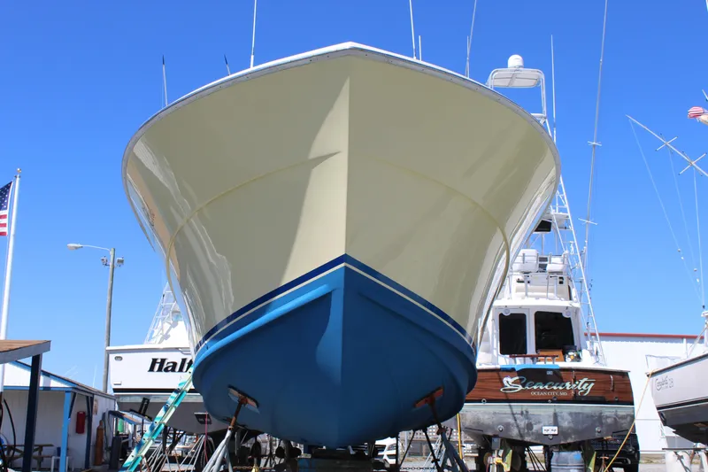 Slide: The Image of 1985 Viking Express boat in dry dock, front view, with clear blue sky. - 3